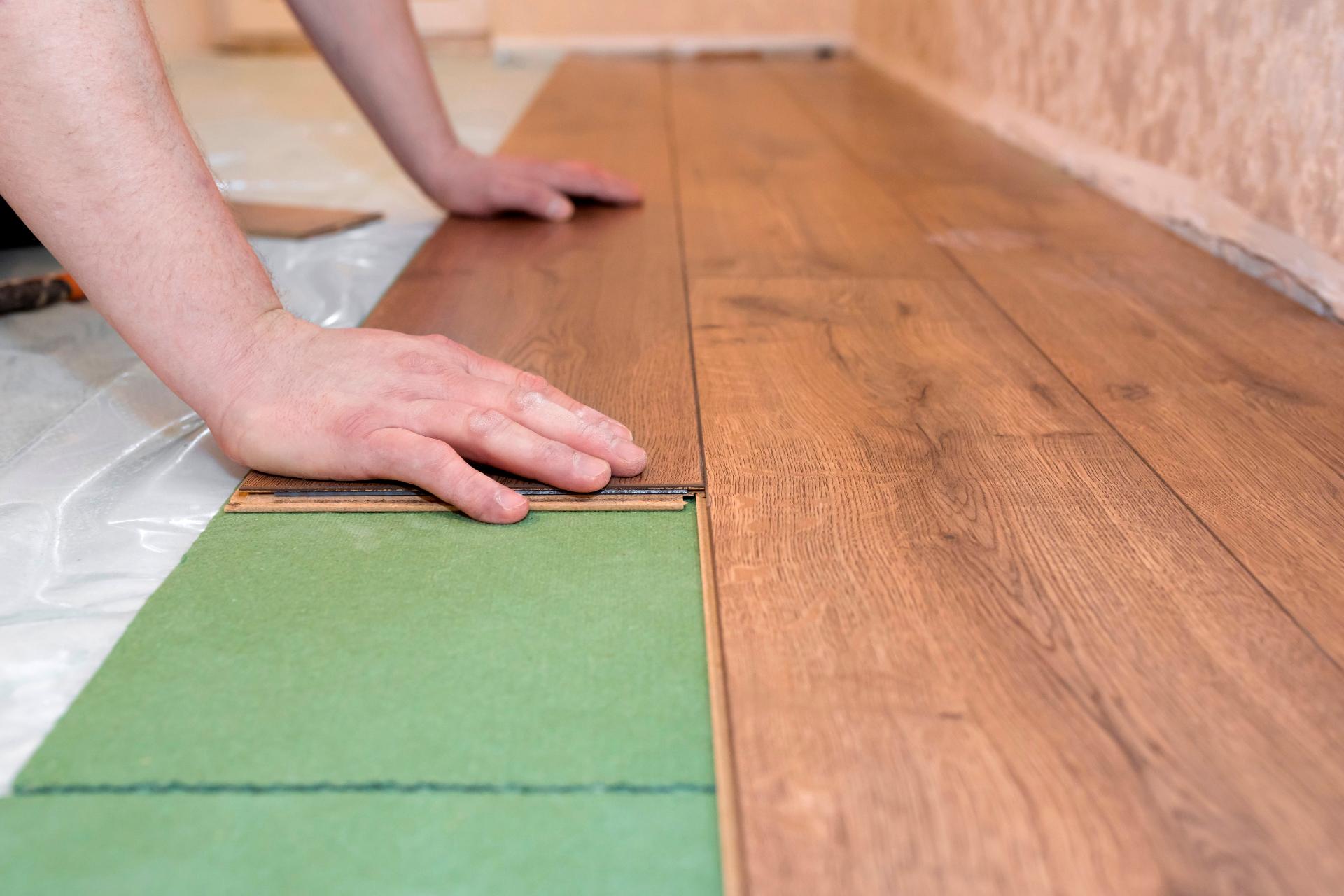 Person working on wooden flooring